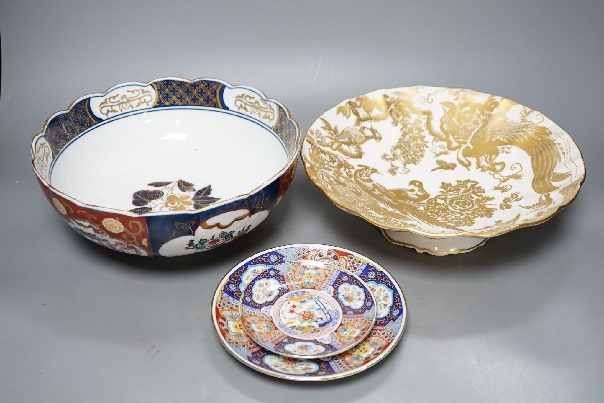 A Royal Crown Derby Imari bowl and two plates and another bowl, 25cm